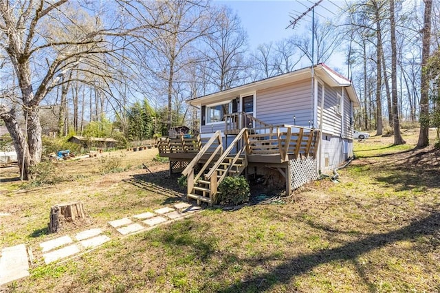 view of front facade featuring stairs and a deck