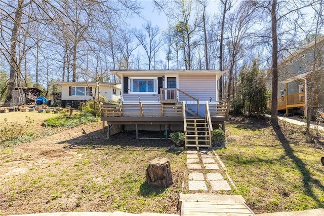 view of front of home with a wooden deck
