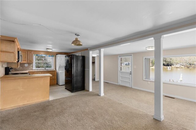 carpeted spare room with a wainscoted wall, crown molding, a wall mounted air conditioner, and visible vents