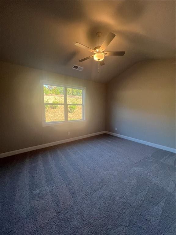 unfurnished room with vaulted ceiling, carpet, and ceiling fan