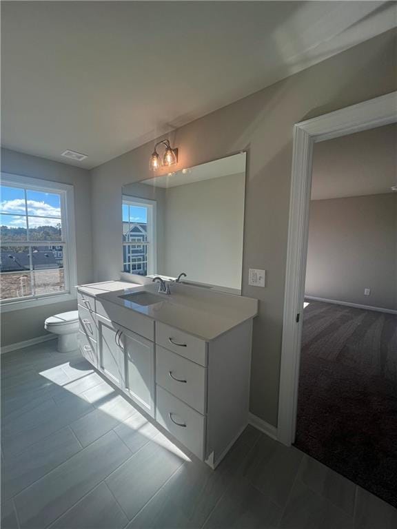 bathroom with vanity and toilet