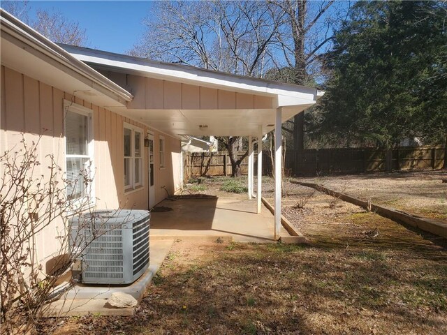 view of yard featuring a patio area, a fenced backyard, and central air condition unit