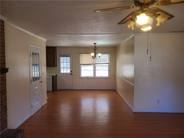 interior space with baseboards, wood finished floors, visible vents, and crown molding