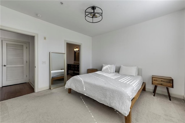 carpeted bedroom featuring a closet