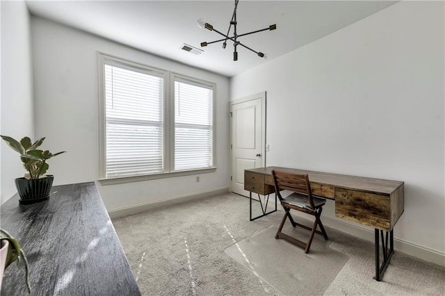 office space with light colored carpet and a notable chandelier