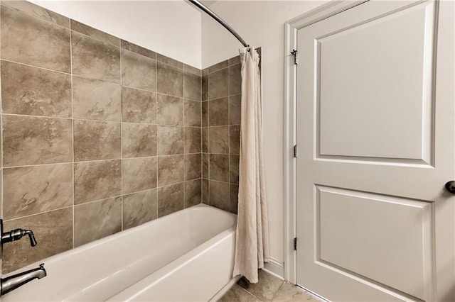 bathroom featuring shower / bathtub combination with curtain and tile patterned flooring