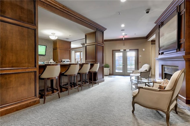 interior space featuring french doors, ornamental molding, and light carpet