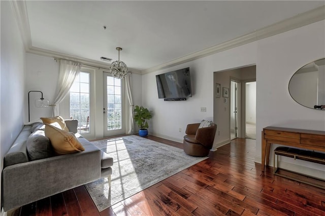 living room with ornamental molding and dark hardwood / wood-style flooring