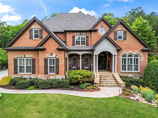 31 Brownson Ct, Acworth, GA 30101 - craftsman house with a porch, brick siding, stone siding, and a front yard