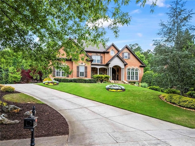 31 Brownson Ct, Acworth, GA 30101 - view of front facade with brick siding and a front yard