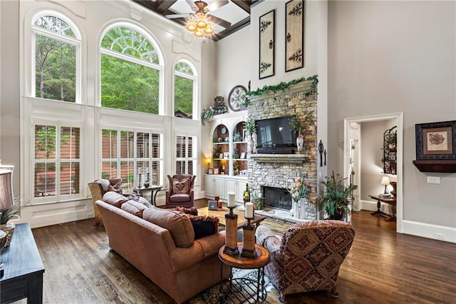 31 Brownson Ct, Acworth, GA 30101 - living room featuring wood finished floors, ceiling fan, a high ceiling, and a fireplace