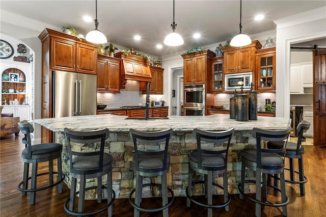 31 Brownson Ct, Acworth, GA 30101 - kitchen featuring crown molding, decorative backsplash, appliances with stainless steel finishes, and brown cabinetry