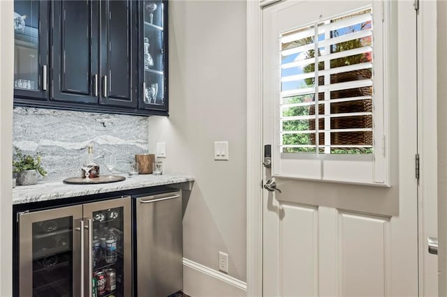 31 Brownson Ct, Acworth, GA 30101 - bar featuring beverage cooler, wet bar, baseboards, and tasteful backsplash
