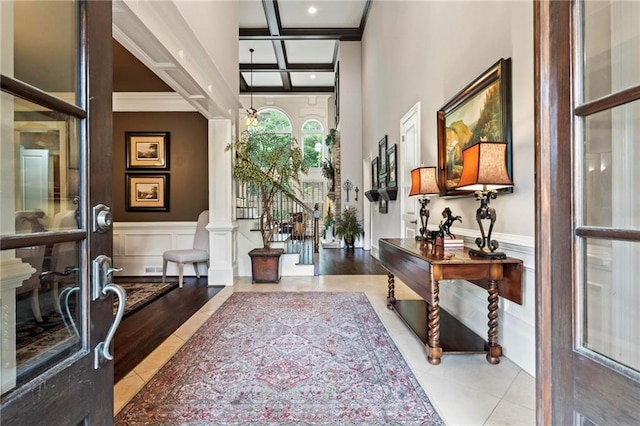 31 Brownson Ct, Acworth, GA 30101 - tiled foyer entrance featuring a decorative wall, a wainscoted wall, beamed ceiling, ornamental molding, and coffered ceiling