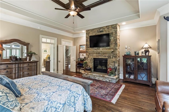 31 Brownson Ct, Acworth, GA 30101 - bedroom featuring a stone fireplace, crown molding, wood finished floors, and a tray ceiling