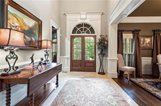 31 Brownson Ct, Acworth, GA 30101 - entrance foyer with french doors, decorative columns, a towering ceiling, and light tile patterned floors