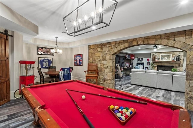 31 Brownson Ct, Acworth, GA 30101 - recreation room featuring wood finished floors, a barn door, pool table, arched walkways, and ceiling fan with notable chandelier