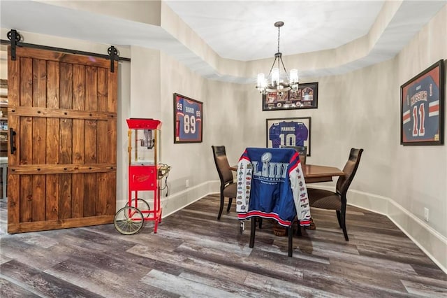 31 Brownson Ct, Acworth, GA 30101 - dining area with baseboards, an inviting chandelier, a barn door, and wood finished floors
