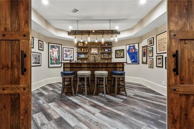 31 Brownson Ct, Acworth, GA 30101 - bar featuring baseboards, wet bar, dark wood-style flooring, and visible vents