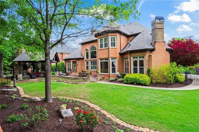 31 Brownson Ct, Acworth, GA 30101 - back of house with fence, a chimney, a patio area, a gazebo, and a yard