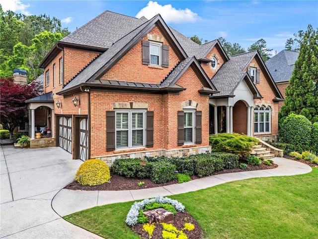 31 Brownson Ct, Acworth, GA 30101 - craftsman house with brick siding, a front lawn, roof with shingles, and concrete driveway