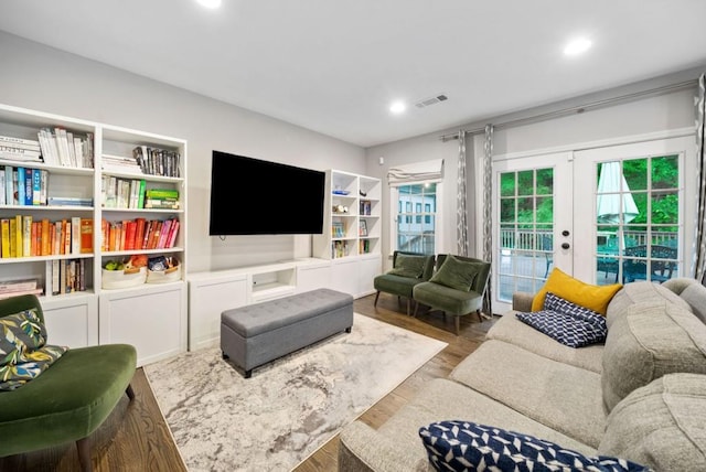 1315 Merry Ln NE, Atlanta, GA 30329 - living area with french doors, wood finished floors, and recessed lighting