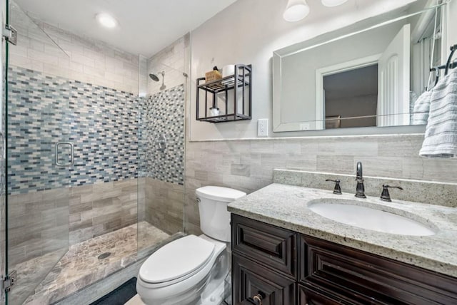 1315 Merry Ln NE, Atlanta, GA 30329 - bathroom with vanity, a stall shower, and tile walls