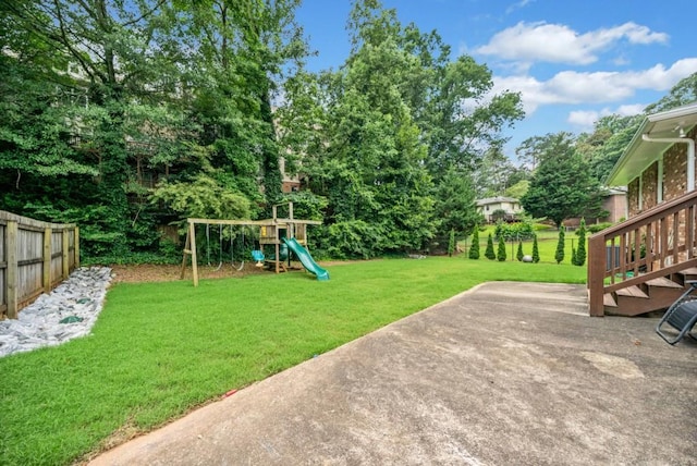 1315 Merry Ln NE, Atlanta, GA 30329 - view of yard featuring a playground and a patio