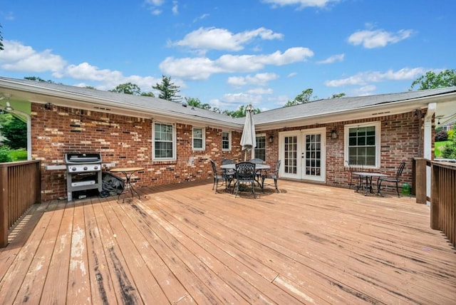 1315 Merry Ln NE, Atlanta, GA 30329 - deck featuring outdoor dining area, french doors, and a grill