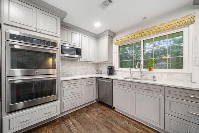 1315 Merry Ln NE, Atlanta, GA 30329 - kitchen with stainless steel appliances, gray cabinetry, tasteful backsplash, dark wood-style floors, and recessed lighting