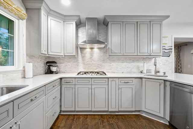 1315 Merry Ln NE, Atlanta, GA 30329 - kitchen featuring stainless steel dishwasher, wall chimney exhaust hood, gray cabinetry, light countertops, and gas stovetop