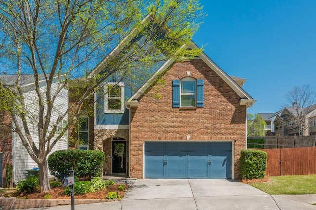 2075 Old Georgian Ter NW, Atlanta, GA 30318 - traditional-style house with a garage, driveway, and brick siding