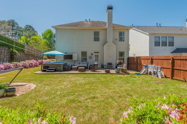 2075 Old Georgian Ter NW, Atlanta, GA 30318 - back of property featuring a hot tub, a patio area, and outdoor lounge area