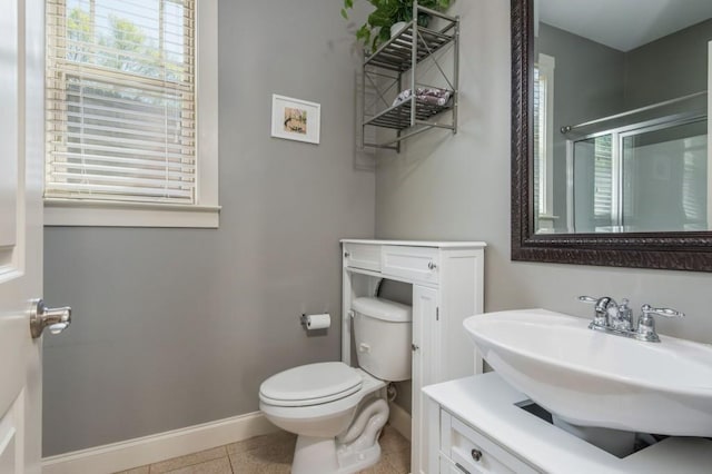 2075 Old Georgian Ter NW, Atlanta, GA 30318 - bathroom with healthy amount of natural light, baseboards, tile patterned flooring, and a stall shower