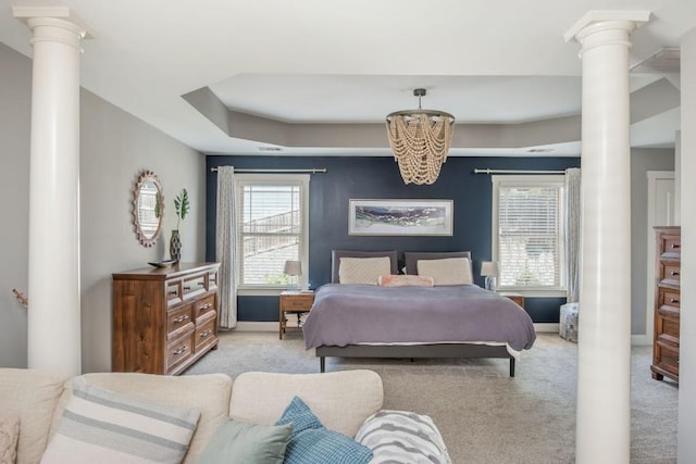 2075 Old Georgian Ter NW, Atlanta, GA 30318 - carpeted bedroom featuring decorative columns, a chandelier, and baseboards