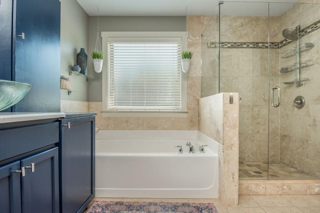2075 Old Georgian Ter NW, Atlanta, GA 30318 - full bathroom with a garden tub, vanity, a stall shower, and tile patterned flooring
