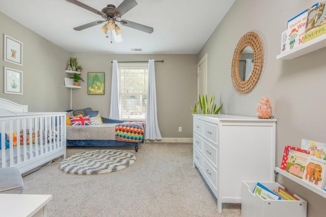 2075 Old Georgian Ter NW, Atlanta, GA 30318 - bedroom featuring light colored carpet, baseboards, and a ceiling fan