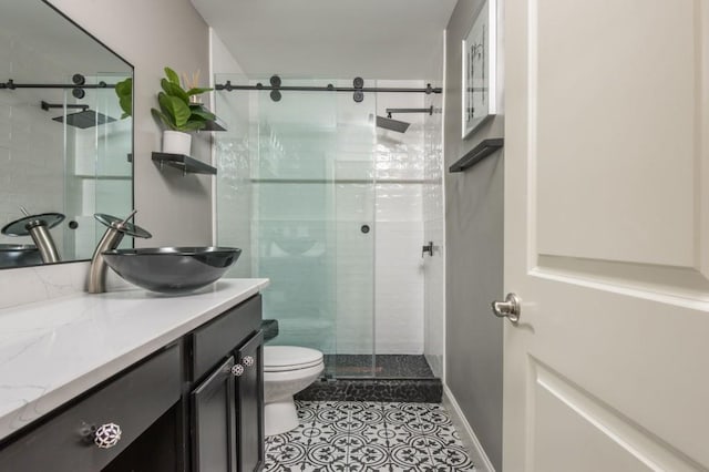 2075 Old Georgian Ter NW, Atlanta, GA 30318 - full bath featuring toilet, a stall shower, vanity, and tile patterned flooring