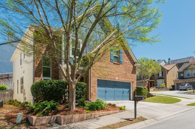 2075 Old Georgian Ter NW, Atlanta, GA 30318 - traditional-style house featuring driveway, an attached garage, brick siding, and central air condition unit