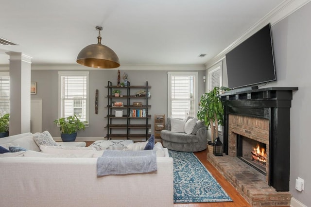 2075 Old Georgian Ter NW, Atlanta, GA 30318 - living room featuring a brick fireplace, wood finished floors, crown molding, and baseboards