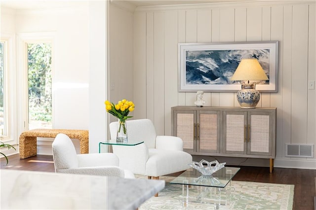 living area with dark wood finished floors and visible vents