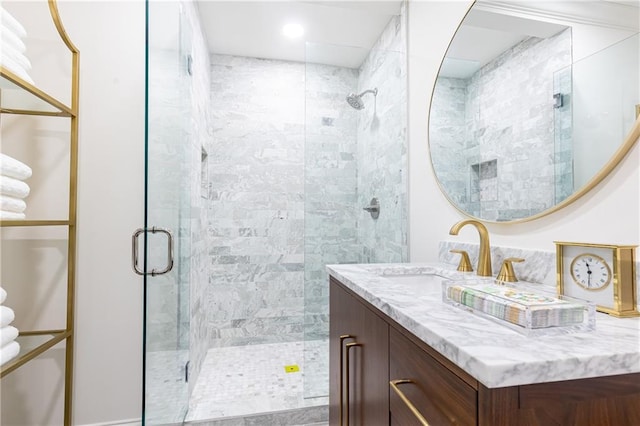 full bathroom with vanity and a shower stall