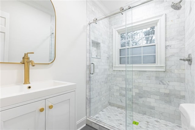 full bathroom with a stall shower and vanity