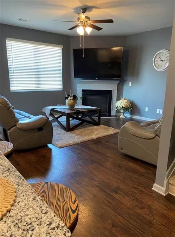 11547 Hathaway Dr, Hampton, GA 30228 - living room with ceiling fan, a fireplace, and wood finished floors