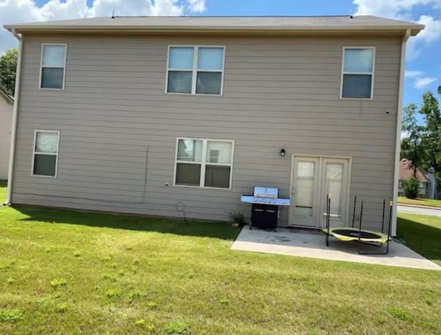 11547 Hathaway Dr, Hampton, GA 30228 - back of house featuring a patio and a yard