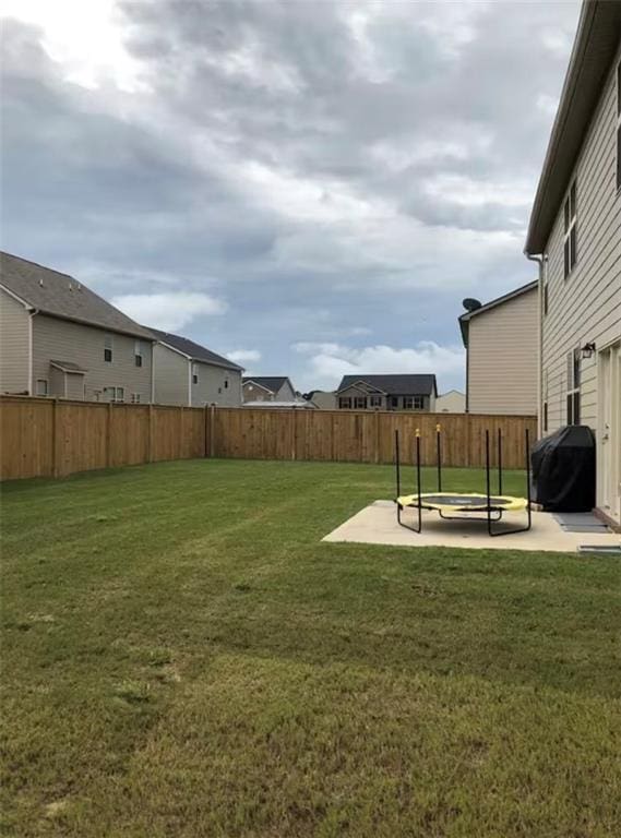 11547 Hathaway Dr, Hampton, GA 30228 - fenced backyard featuring a patio