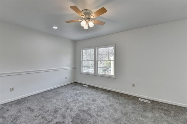 carpeted empty room featuring ceiling fan