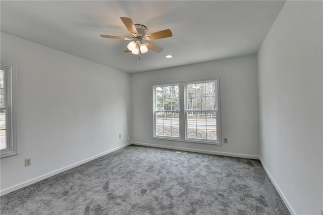 carpeted empty room with ceiling fan