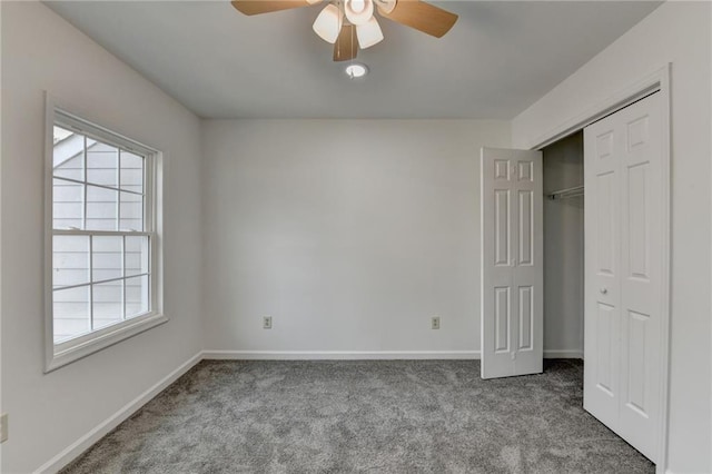 unfurnished bedroom featuring light carpet, ceiling fan, and a closet