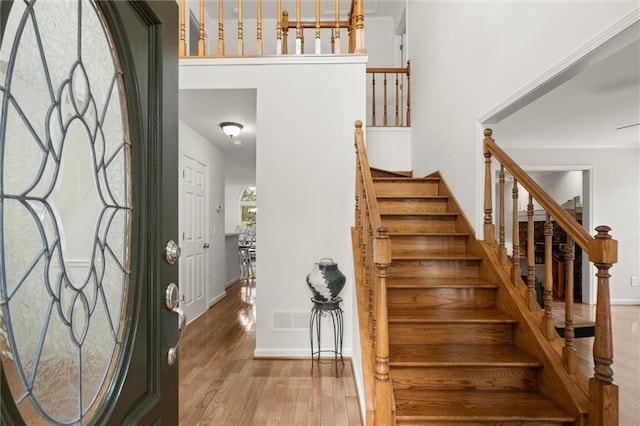 1418 Mill Path Loop, Lawrenceville, GA 30045 - entrance foyer with wood finished floors, stairway, and ornamental molding
